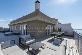 Modern penthouse with wonderful roof terrace and sea view
