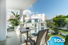 Stylish penthouse in exclusive residential complex with partial sea view in Palmanova