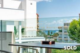 Stylish penthouse in exclusive residential complex with partial sea view in Palmanova