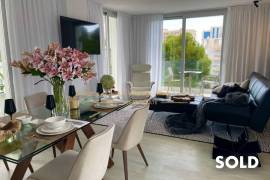 Stylish penthouse in exclusive residential complex with partial sea view in Palmanova